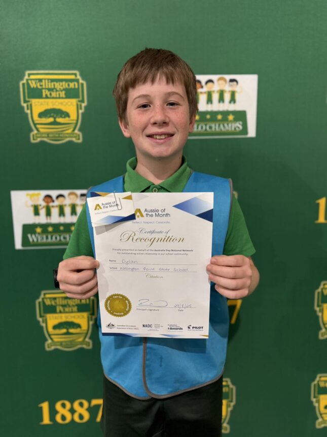 boy student holding certificate and smiling to camera